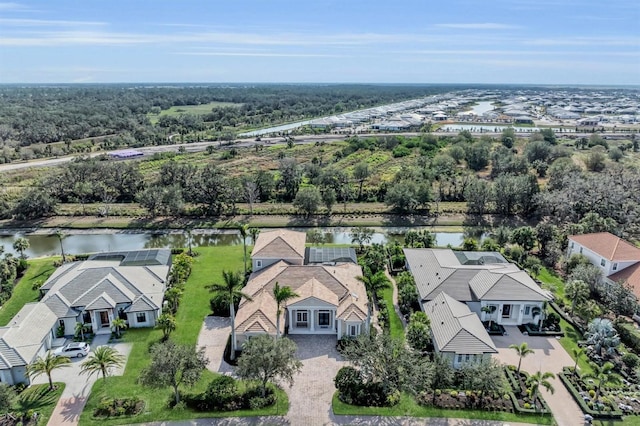 drone / aerial view with a water view