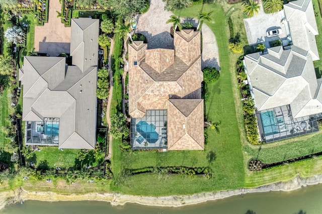 birds eye view of property with a water view