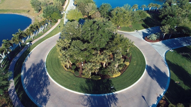 birds eye view of property with a water view