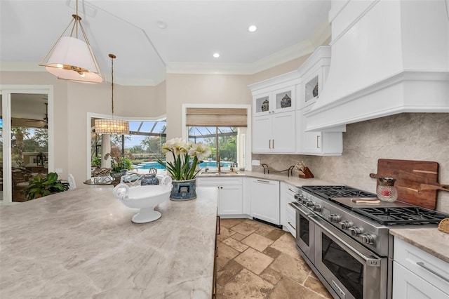 kitchen featuring white cabinets, glass insert cabinets, white dishwasher, double oven range, and pendant lighting