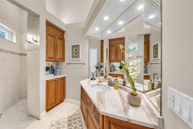 full bath with recessed lighting, vanity, baseboards, and walk in shower