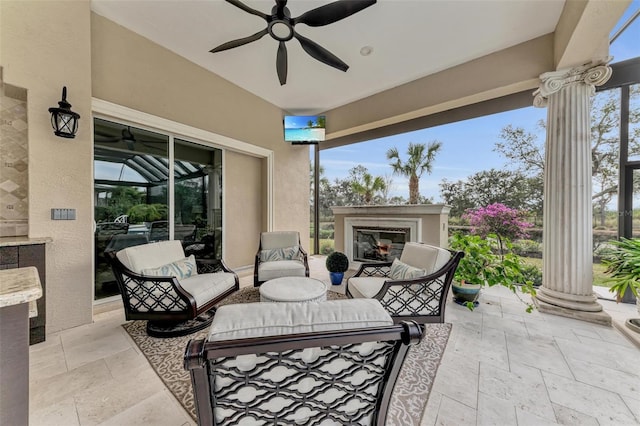 view of patio featuring a glass covered fireplace