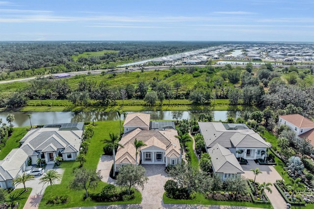 birds eye view of property with a residential view and a water view