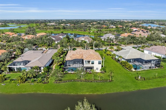 birds eye view of property with a residential view and a water view