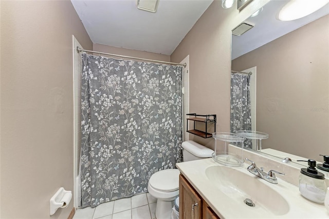 bathroom featuring tile patterned floors, toilet, a shower with shower curtain, and vanity