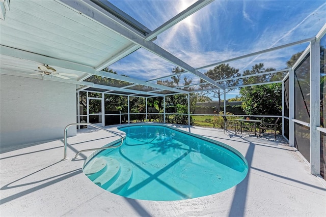 view of pool featuring a patio and glass enclosure