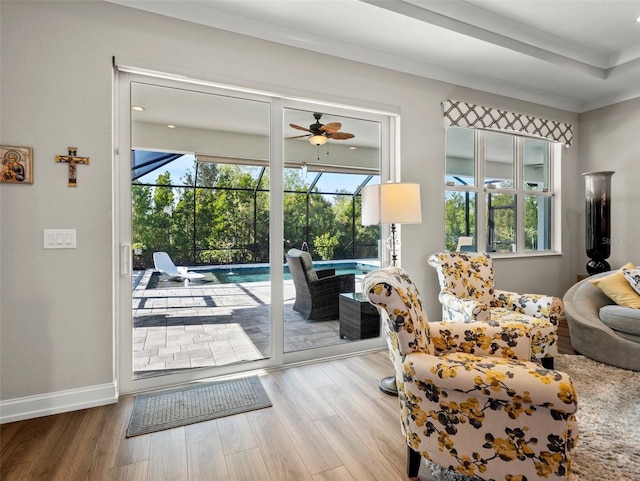 doorway to outside with crown molding, hardwood / wood-style floors, and a wealth of natural light