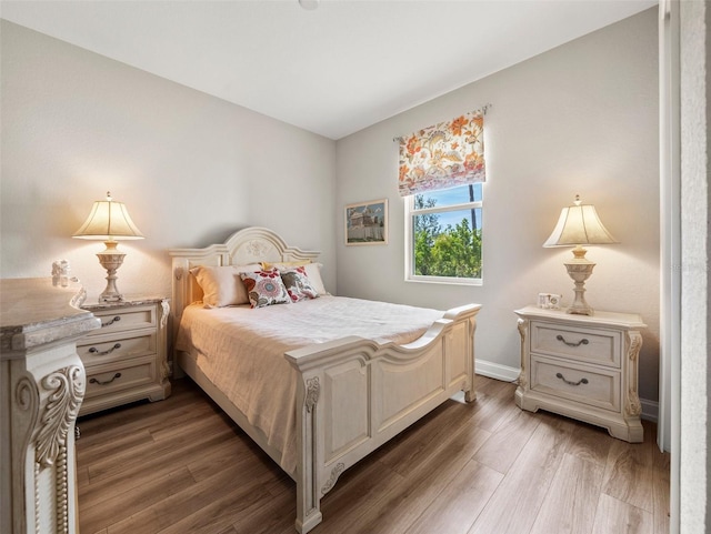 bedroom featuring dark hardwood / wood-style flooring