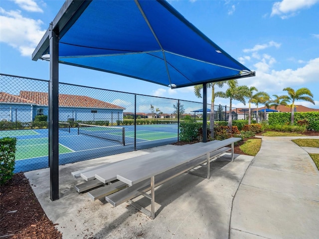 surrounding community featuring tennis court