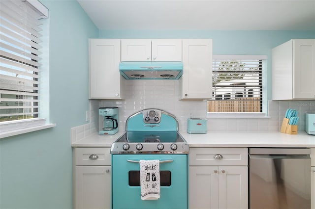 kitchen with stove, white cabinetry, stainless steel dishwasher, and decorative backsplash