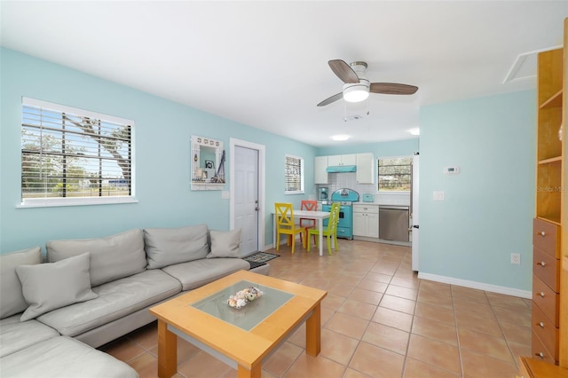 living room featuring light tile patterned floors and ceiling fan