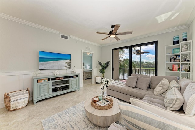 tiled living room featuring crown molding and ceiling fan