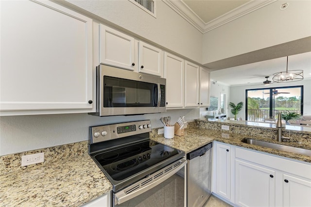 kitchen featuring sink, stainless steel appliances, and white cabinets