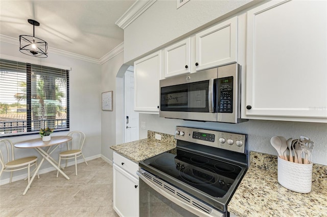 kitchen featuring ornamental molding, stainless steel appliances, decorative light fixtures, and white cabinets