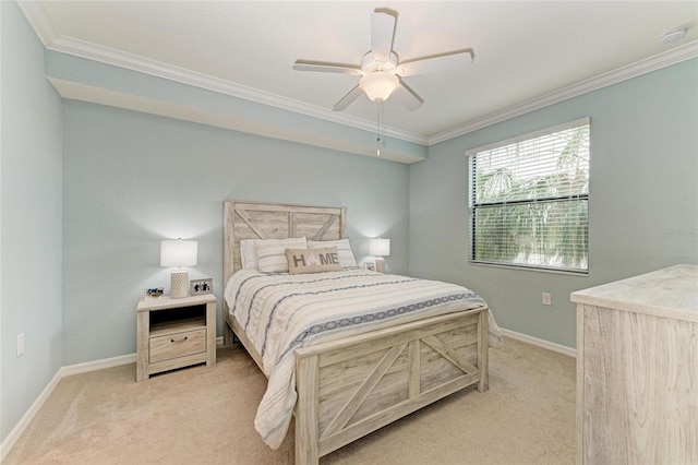 carpeted bedroom with ceiling fan and ornamental molding