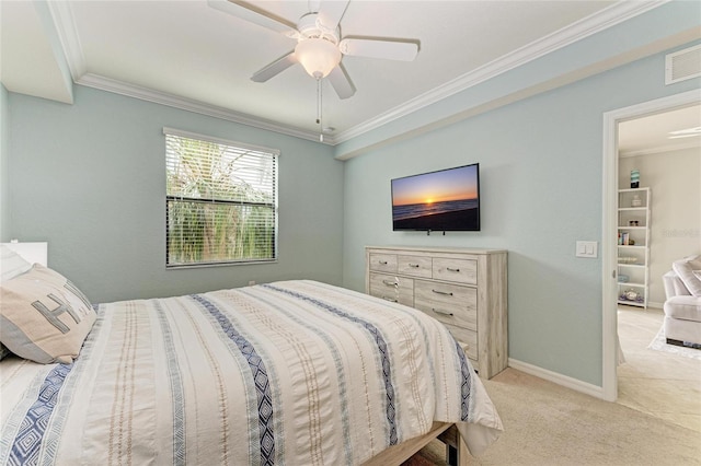 bedroom with ceiling fan, ornamental molding, and light carpet