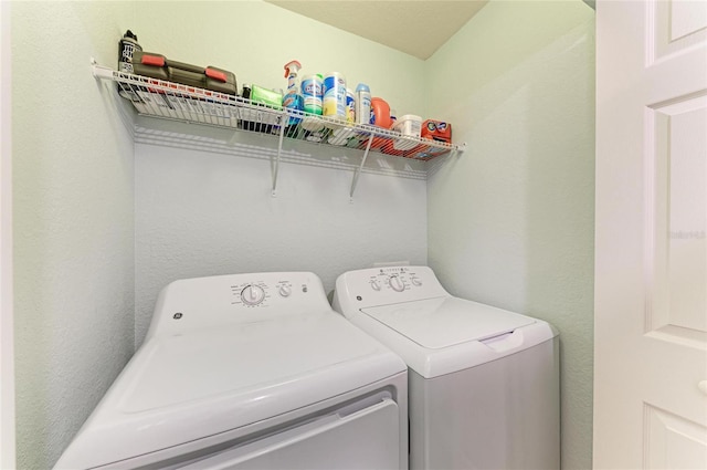 washroom featuring washer and dryer