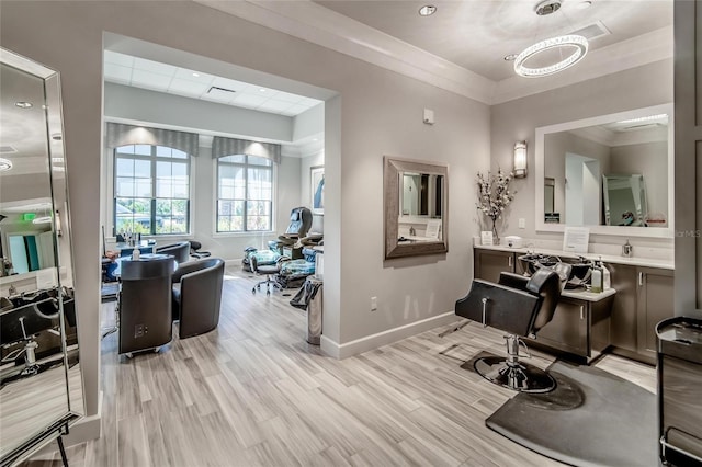 interior space featuring vanity, hardwood / wood-style flooring, and ornamental molding