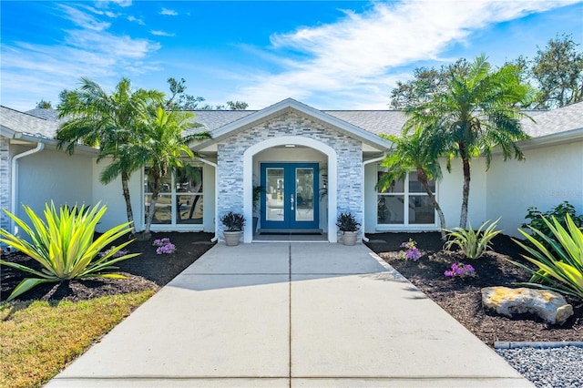 view of exterior entry featuring french doors