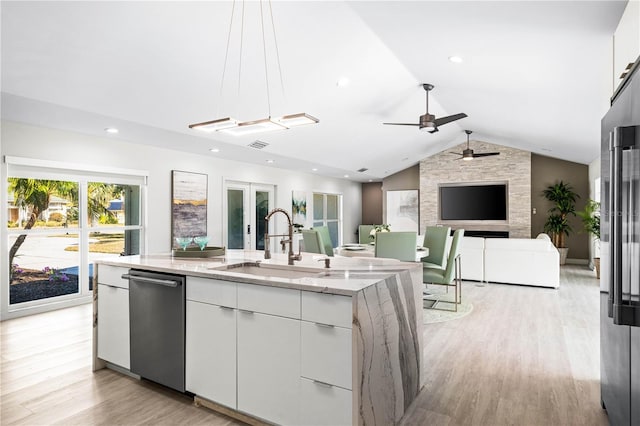 kitchen with sink, white cabinetry, dishwasher, pendant lighting, and a kitchen island with sink