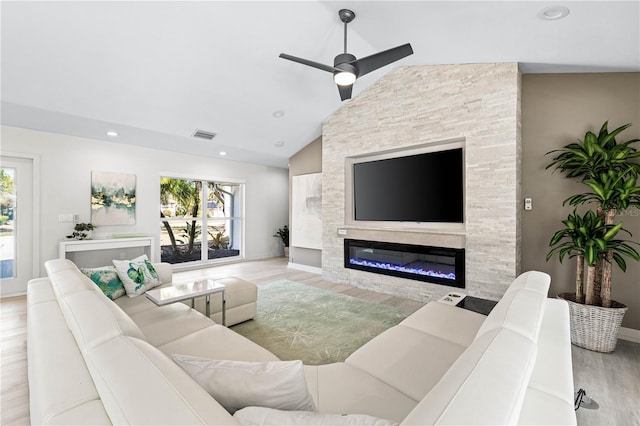 living room with ceiling fan, high vaulted ceiling, light hardwood / wood-style flooring, and a wealth of natural light