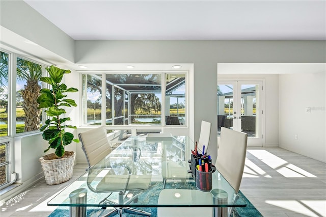 dining room featuring light hardwood / wood-style floors and french doors