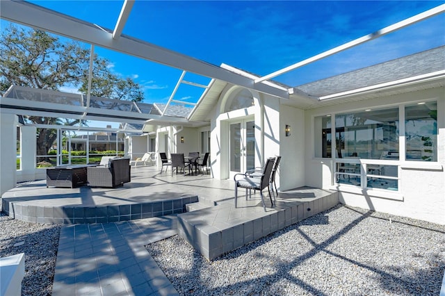 view of patio / terrace with an outdoor living space and a lanai