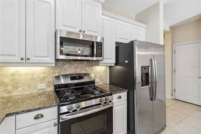 kitchen featuring white cabinetry, appliances with stainless steel finishes, tasteful backsplash, and light tile patterned floors