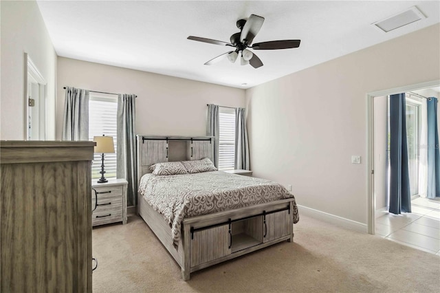 bedroom featuring light carpet and ceiling fan