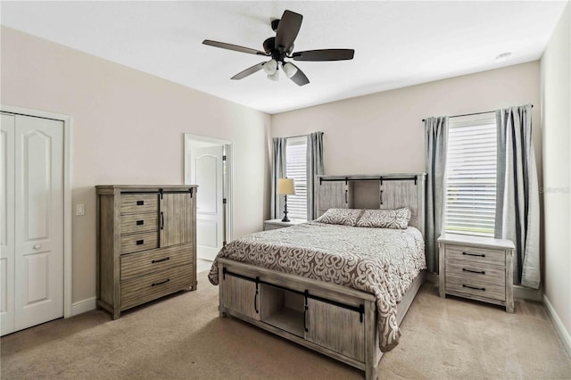 bedroom with light colored carpet and ceiling fan