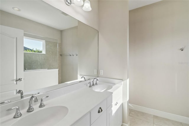 bathroom featuring tile patterned flooring and vanity