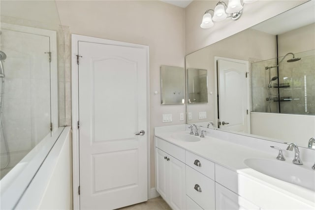 bathroom featuring vanity and a tile shower