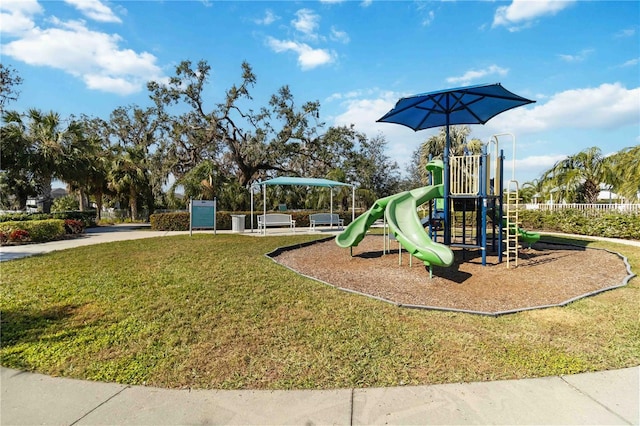 view of playground featuring a lawn