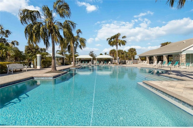 view of swimming pool featuring a patio area