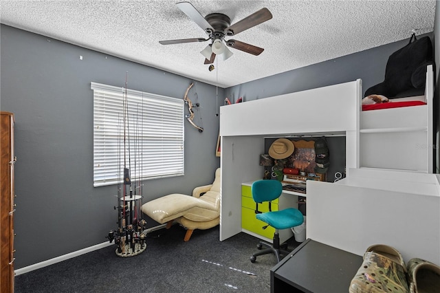 carpeted bedroom featuring ceiling fan and a textured ceiling