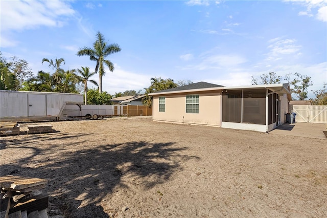 rear view of house with a sunroom