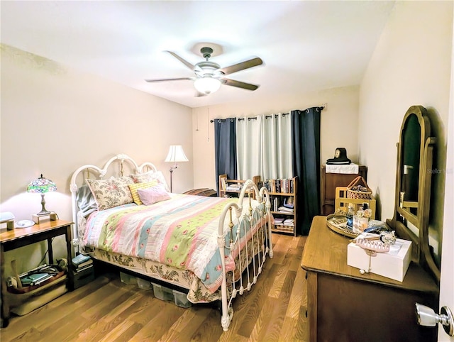 bedroom featuring ceiling fan and hardwood / wood-style floors