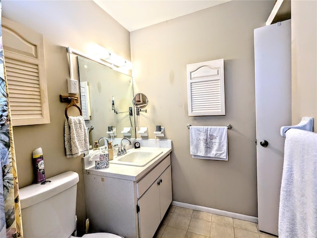 full bath with tile patterned flooring, baseboards, vanity, and toilet