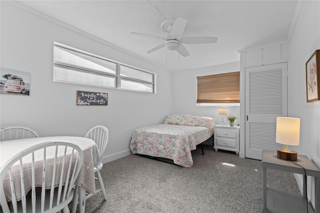 carpeted bedroom with ceiling fan and ornamental molding