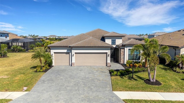 view of front facade with a garage and a front lawn