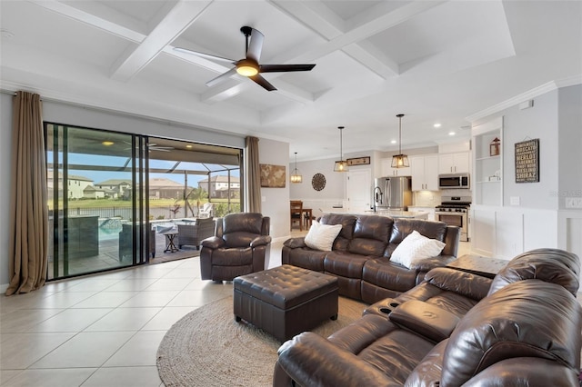 5035 Seafoam Trl, Bradenton, FL 34211 - living room featuring coffered ceiling, ceiling fan, crown molding, light tile patterned flooring, and a wainscoted wall
