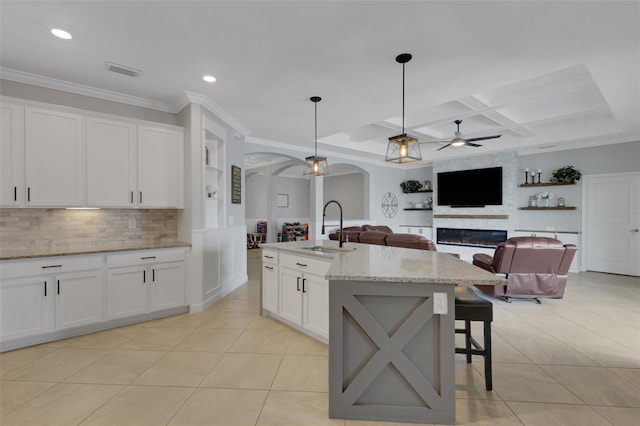 5035 Seafoam Trl, Bradenton, FL 34211 - kitchen with a sink, arched walkways, a ceiling fan, light tile patterned flooring, and coffered ceiling