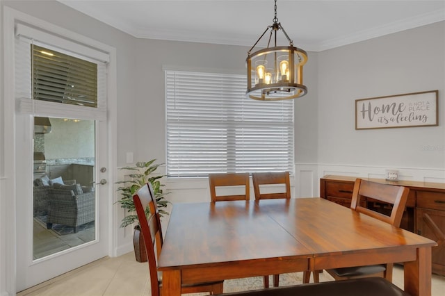 5035 Seafoam Trl, Bradenton, FL 34211 - dining room featuring a chandelier, crown molding, and light tile patterned floors