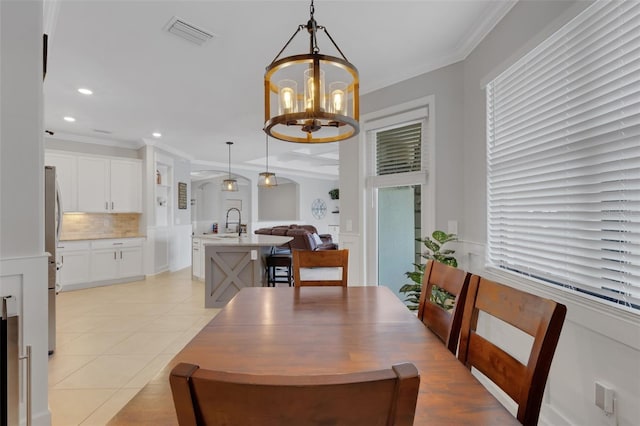 5035 Seafoam Trl, Bradenton, FL 34211 - dining space with a chandelier, light tile patterned floors, crown molding, and recessed lighting