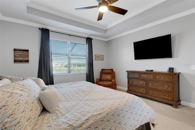 5035 Seafoam Trl, Bradenton, FL 34211 - bedroom featuring a tray ceiling, light carpet, ornamental molding, baseboards, and a ceiling fan