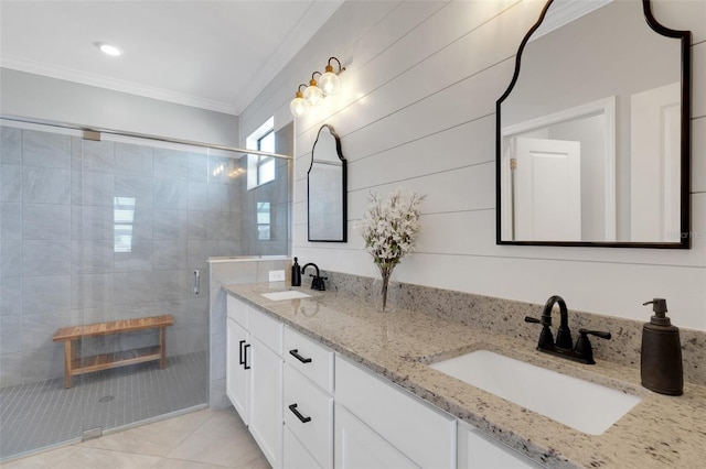 5035 Seafoam Trl, Bradenton, FL 34211 - bathroom featuring double vanity, ornamental molding, a shower stall, and tile patterned flooring