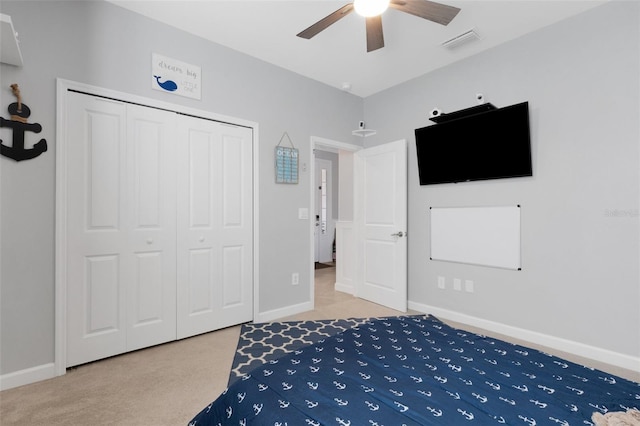 5035 Seafoam Trl, Bradenton, FL 34211 - carpeted bedroom featuring a closet, baseboards, and a ceiling fan
