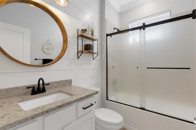 5035 Seafoam Trl, Bradenton, FL 34211 - full bath with vanity, crown molding, toilet, and bath / shower combo with glass door