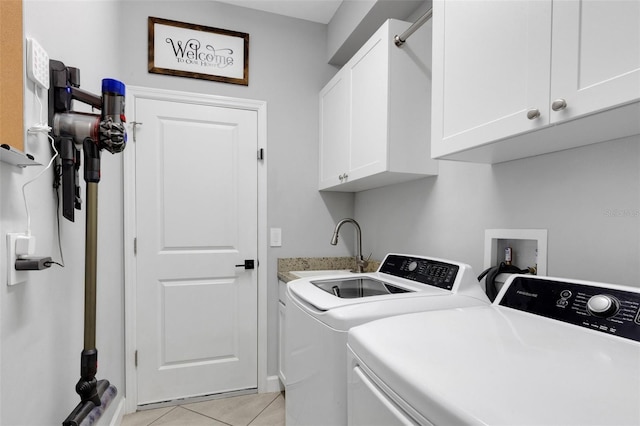 5035 Seafoam Trl, Bradenton, FL 34211 - laundry area with cabinet space, washer and clothes dryer, and light tile patterned flooring