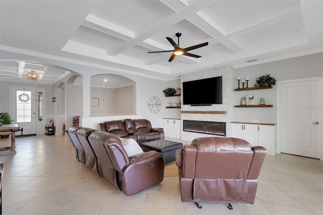 5035 Seafoam Trl, Bradenton, FL 34211 - living room with coffered ceiling, light tile patterned floors, a ceiling fan, arched walkways, and beam ceiling